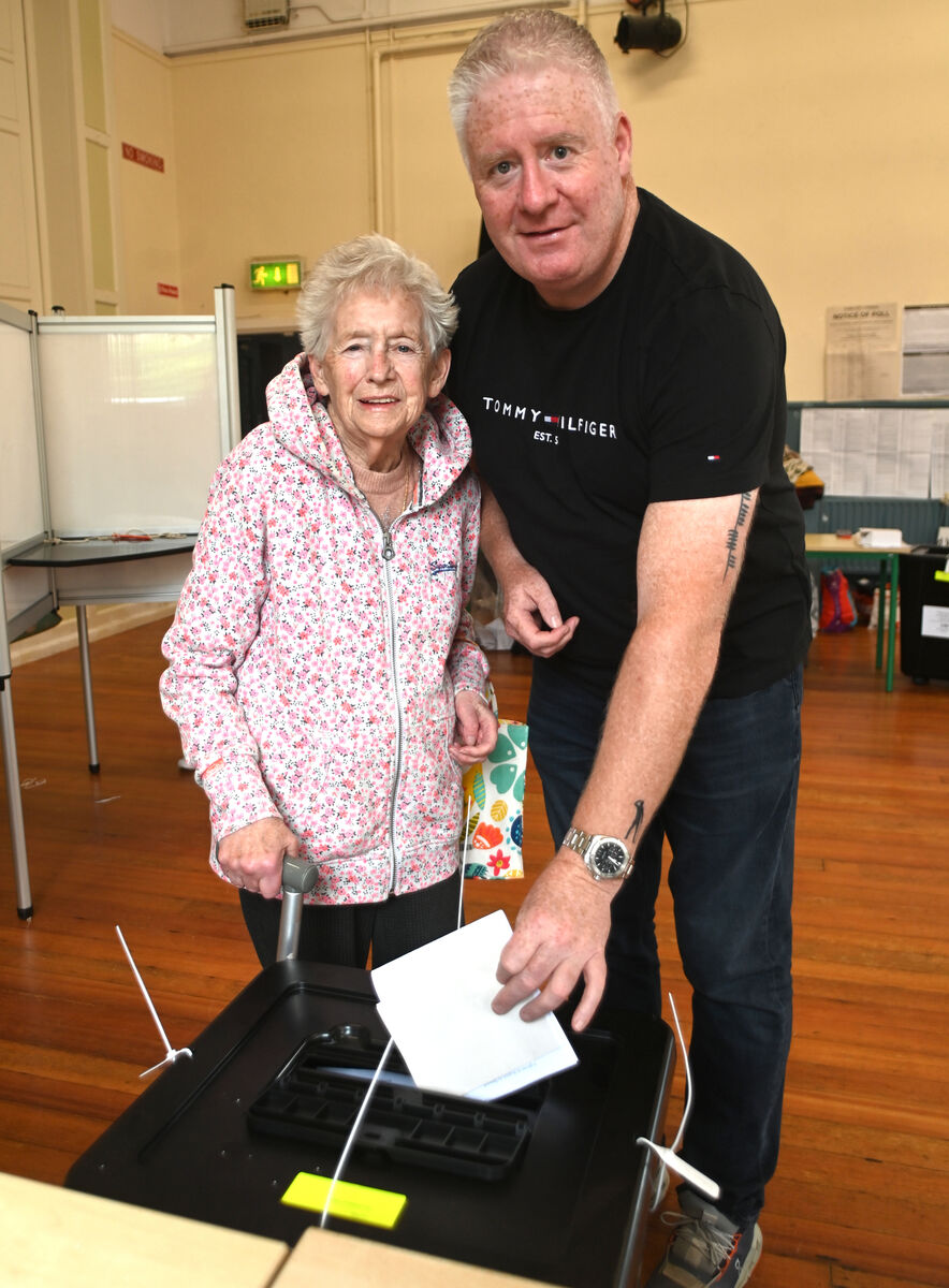 Outgoing independent city councillor Mick Finn who is not contesting this election, voted with his mum Marie, who is 86 years old this month, at Bunscoil Chriost Ri, Turner's Cross , Cork. Pic: Larry Cummins Outgoing independent city councillor Mick Finn who is not contesting this election, voted with his mum Marie, who is 86 years old this month, at Bunscoil Chriost Ri, Turner's Cross , Cork. Pic: Larry Cummins