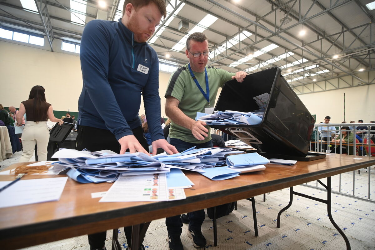 Count staff Aidan Walsh and Kevin O'Reilly counting votes. The separation of local and European ballot papers is underway after the opening of the ballot boxes at Nemo Rangers GAA club on Saturday morning. Pic: Larry Cummins