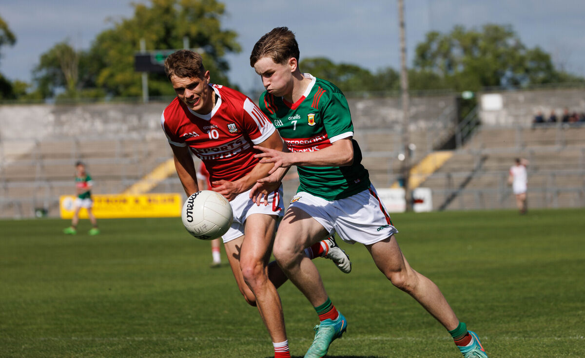  Mayo’s Mark Sheerin and Cork’s Harry Cogan in action at Cusack Park in Ennis. Picture: Eamon Ward