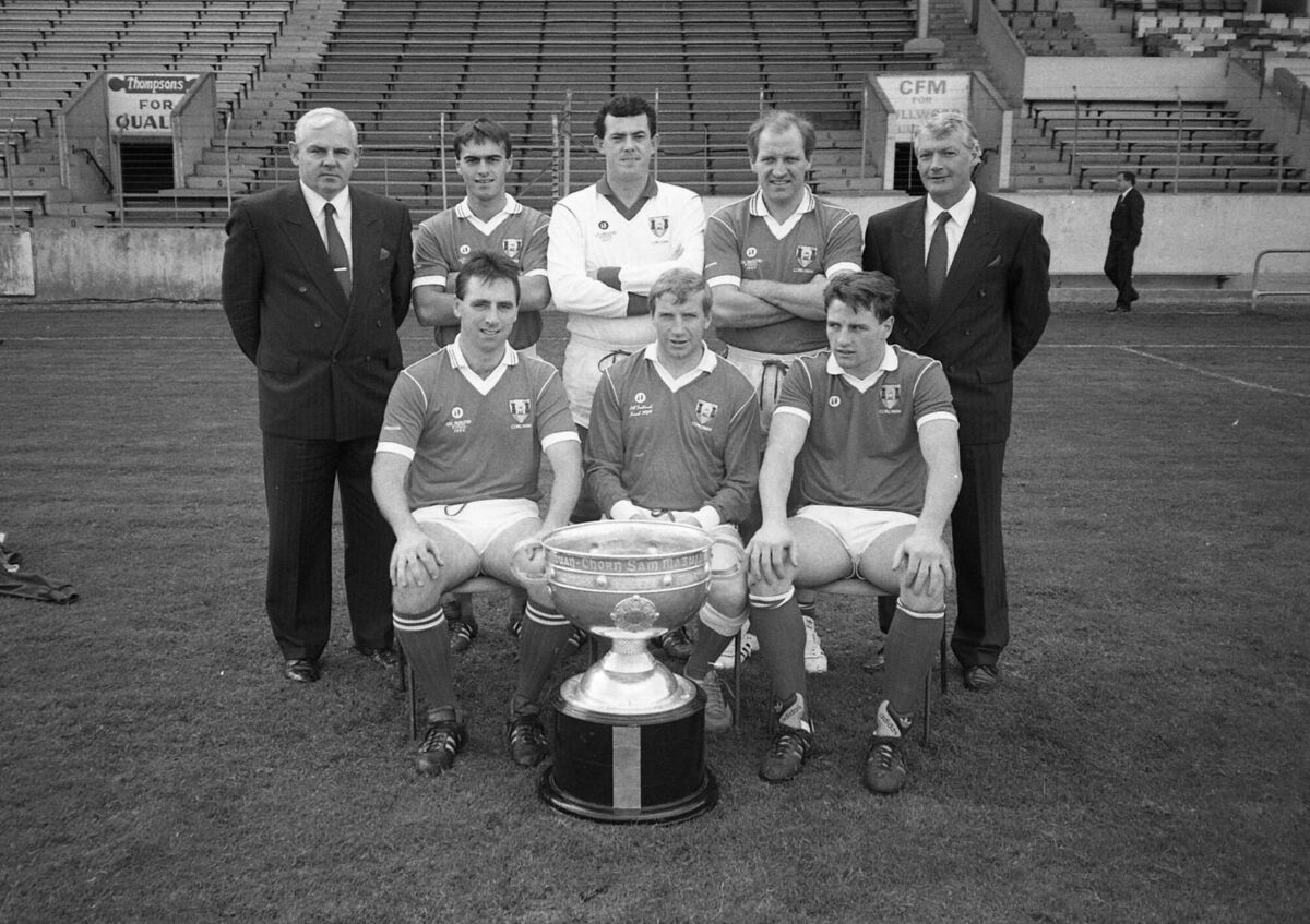 John Kerins with his former past-pupils of Coláiste Chríost Rí after the 1989 All-Ireland victory over Mayo. Seated, from left: Jimmy Kerrigan, Dinny Allen, captain and Stephen O’Brien. Back: Frank Cogan, Tony Nation, John Kerins, Dave Barry and Billy Morgan, Cork manager. Picture: Kevin Cummins John Kerins with his former past-pupils of Coláiste Chríost Rí after the 1989 All-Ireland victory over Mayo. Seated, from left: Jimmy Kerrigan, Dinny Allen, captain and Stephen O’Brien. Back: Frank Cogan, Tony Nation, John Kerins, Dave Barry and Billy Morgan, Cork manager. Picture: Kevin Cummins