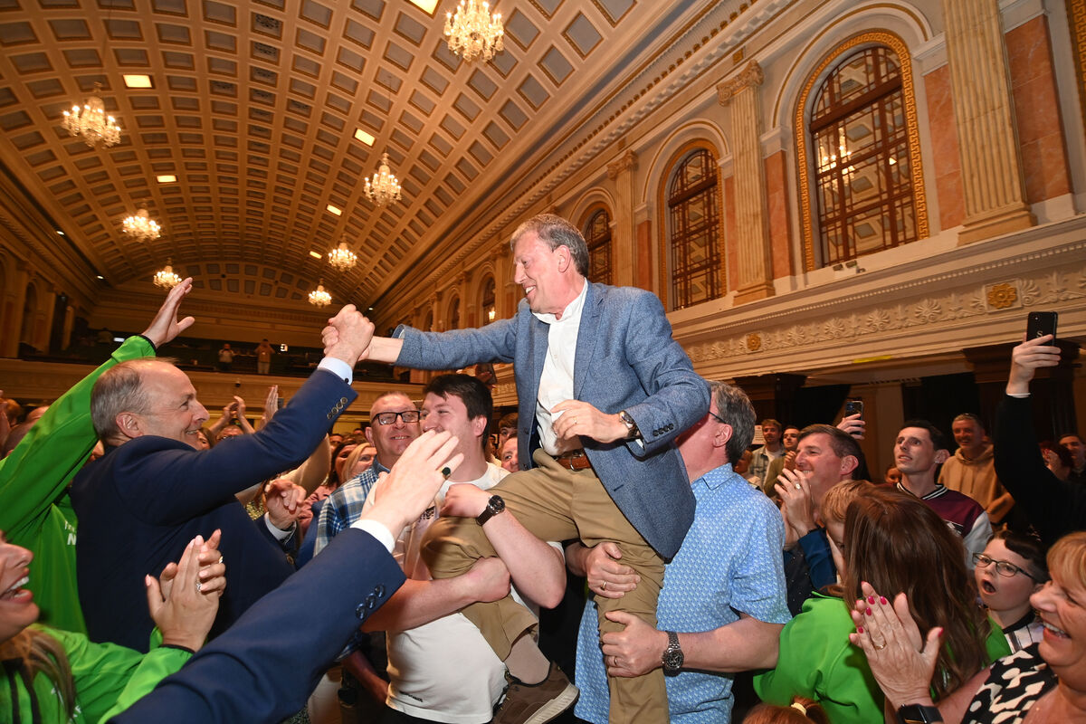  Tanaiste Micheal Martin and supporters with Cllr Tony Fitzgerald celebrating as his re-election is announced at Cork City Hall on Saturday 8th June 2024. Pic Larry Cummins