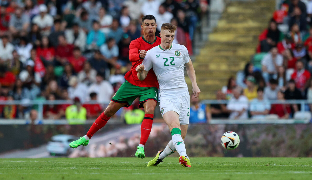 Portugal's Cristiano Ronaldo with Jake O'Brien of Ireland in action. Picture: INPHO/Ryan Byrne Portugal's Cristiano Ronaldo with Jake O'Brien of Ireland in action. Picture: INPHO/Ryan Byrne