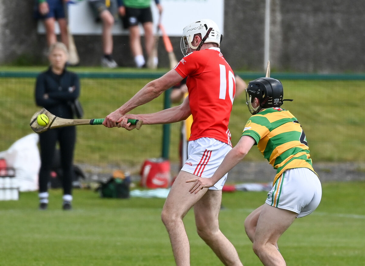  Charleville's Tim Hawe shoots as Blackrock's Ollie McAdoo closes in, during their SHL clash at Church Road.