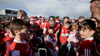 Eoin Downey poses for photos with fans after the game 15/6/2024