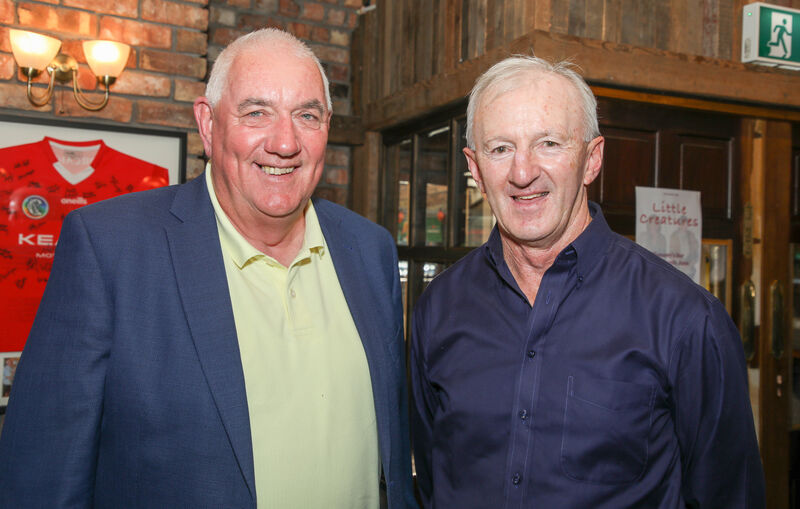  Tadhg Murphy, who captained Farranferris to win the Dr Harty Cup and All-Ireland title in 1974, with Francis Collins at the 50th anniversary reunion. Picture: Picture David Creedon