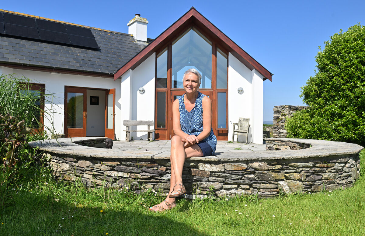 Sarah outside her home.