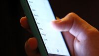 Teenager using mobile phone stock