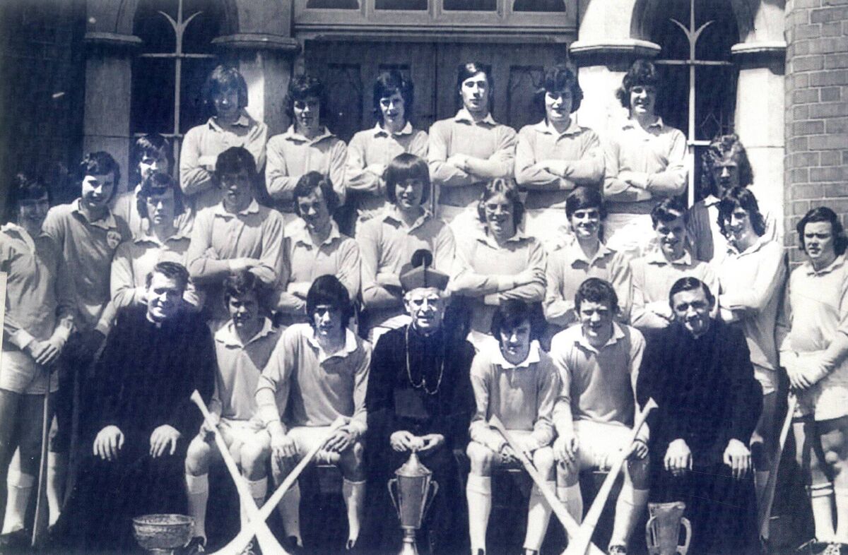 The Farranferris team that won the 1974 Dr Harty Cup. Back: T Murphy, J O'Sullivan, K O'Driscoll, D Forde, M O'Sullivan, P O'Regan. Middle: J Whooley, M Moir, T Cashman, M Murphy, T Hourihan, P Hayes, JJ Murphy, G McEvoy, F Crowley, F Tobin, D Cronin, J O'Reilly, G Crowley. Front: Fr M O'Brien, J Higgins, T Murphy, Bishop Lucey, F Collins, J Crowley, Fr M Murphy. The Farranferris team that won the 1974 Dr Harty Cup. Back: T Murphy, J O'Sullivan, K O'Driscoll, D Forde, M O'Sullivan, P O'Regan. Middle: J Whooley, M Moir, T Cashman, M Murphy, T Hourihan, P Hayes, JJ Murphy, G McEvoy, F Crowley, F Tobin, D Cronin, J O'Reilly, G Crowley. Front: Fr M O'Brien, J Higgins, T Murphy, Bishop Lucey, F Collins, J Crowley, Fr M Murphy.