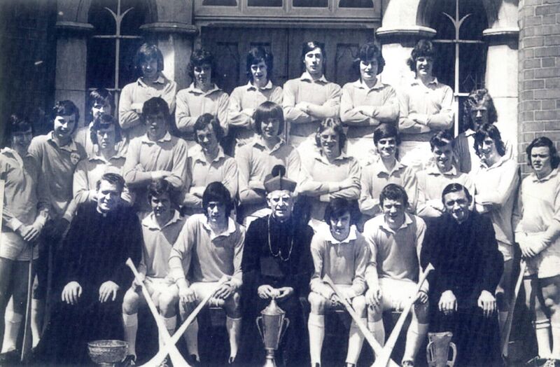 The Farranferris team that won the 1974 Dr Harty Cup. Back: T Murphy, J O'Sullivan, K O'Driscoll, D Forde, M O'Sullivan, P O'Regan. Middle: J Whooley, M Moir, T Cashman, M Murphy, T Hourihan, P Hayes, JJ Murphy, G McEvoy, F Crowley, F Tobin, D Cronin, J O'Reilly, G Crowley. Front: Fr M O'Brien, J Higgins, T Murphy, Bishop Lucey, F Collins, J Crowley, Fr M Murphy. 