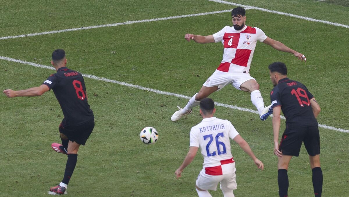 Albania's Klaus Gjasula, left, scores his side's second goal in the  Group B match against  Croatia  in Hamburg. Picture: Jens Buettner/dpa via AP