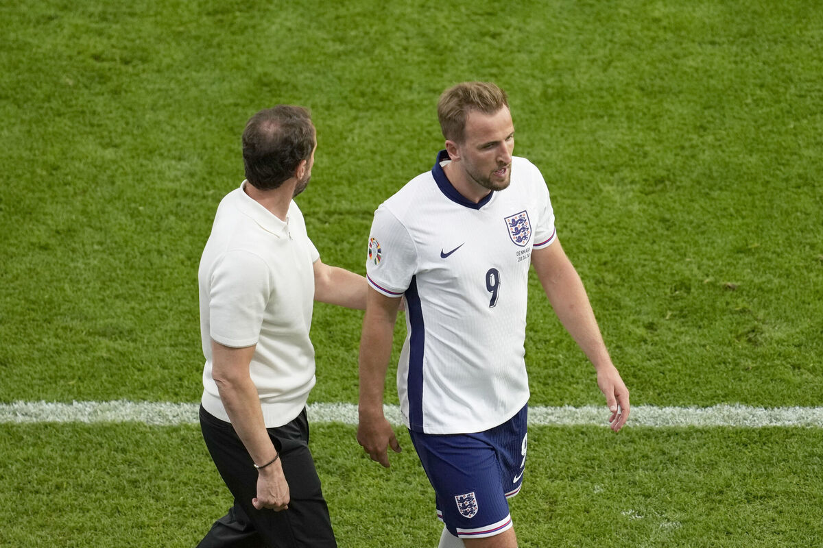 England's Harry Kane walks to the bench past England's manager Gareth Southgate after being substituted during a Group C match against  Denmark in Frankfurt, Germany, on  Thursday, Picture: AP Photo/Darko Vojinovic