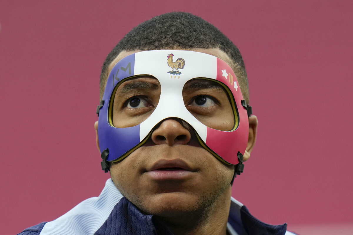 France's Kylian Mbappe wears a face mask to protect his broken nose during a training session in Leipzig, Germany, ahead of the game against the Netherland. Picture: AP Photo/Hassan Ammar