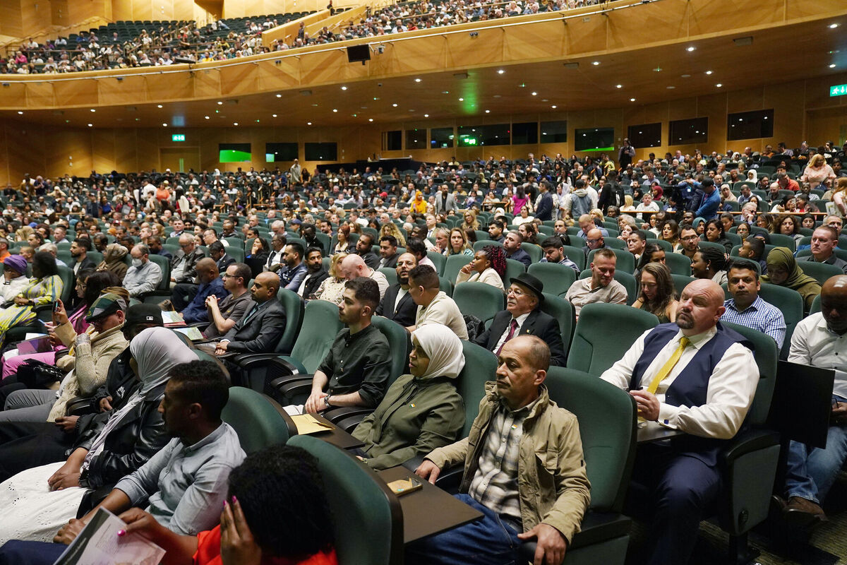 People attend citizenship ceremonies for more than 5,400 people at the Convention Centre in Dublin. Brian Lawless/PA Wire