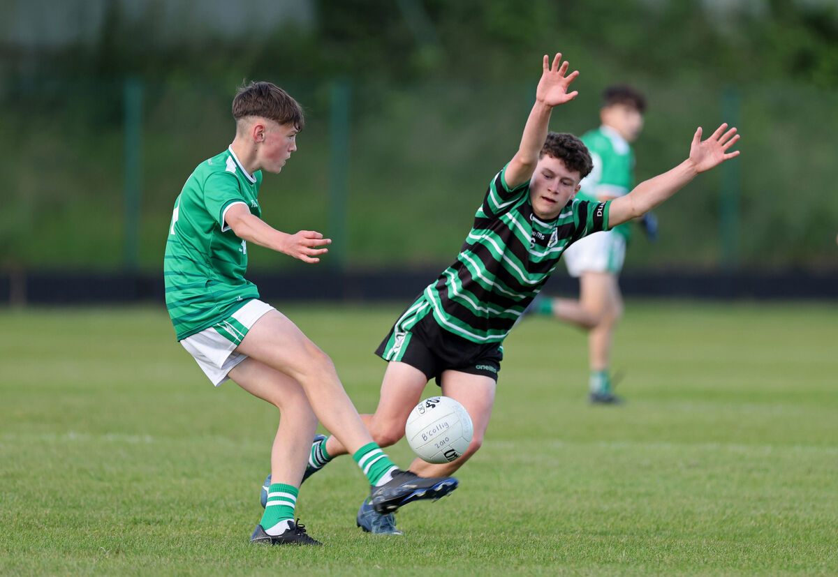  Shay O'Brien, Ballincollig, shoots from Leo Reidy, Douglas. Picture: Jim Coughlan.