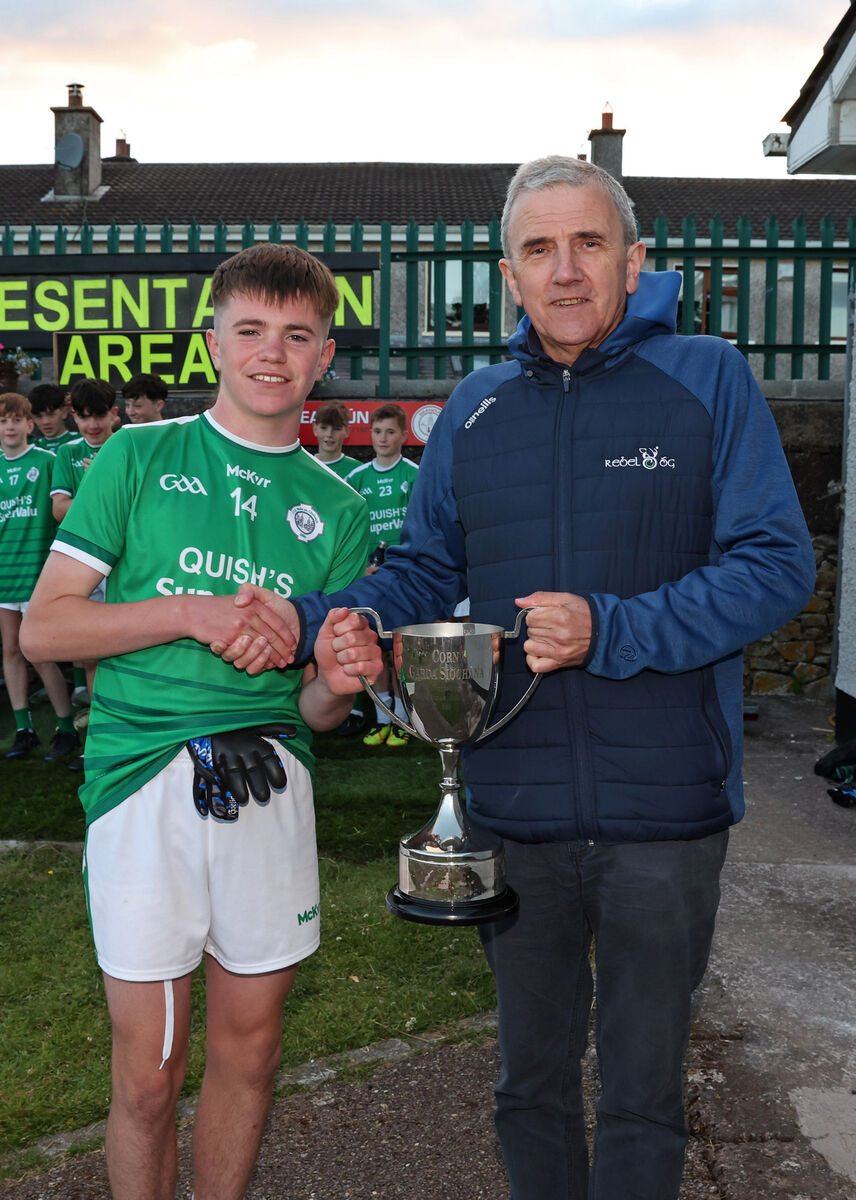  Liam O'Brien, Ballincollig, receives the cup from Michael O'Mahony. Picture: Jim Coughlan.