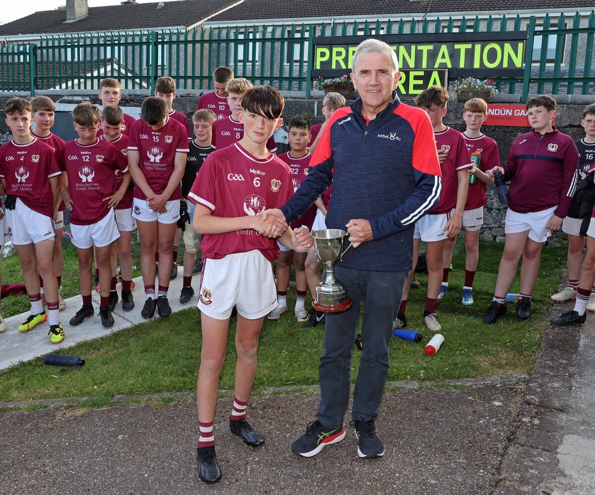 Alex O'Callaghan, Bishopstown, captain receives the cup from Michael O'Mahony. Picture: Jim Coughlan.  Alex O'Callaghan, Bishopstown, captain receives the cup from Michael O'Mahony. Picture: Jim Coughlan.