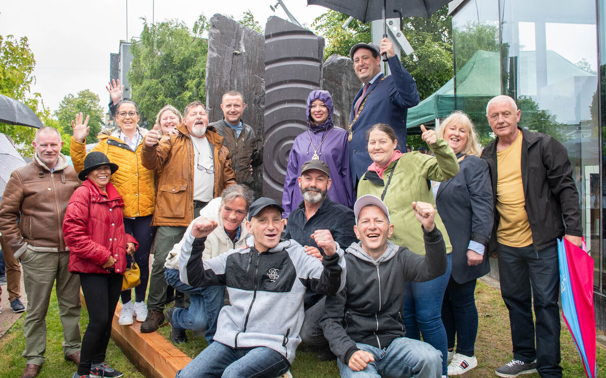 Volunteers from Headway and Simon Community celebrate with Project Facilitator Tommy Lysaght in the unveiling of the three stone sculptures entitled 'Scenius' with Lord Mayor Kieran McCarthy at the Peace Park in South Mall. Picture: Howard Crowdy