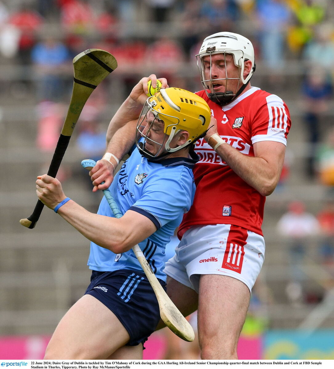 Daire Gray of Dublin is tackled by Tim O'Mahony. Picture: Ray McManus/Sportsfile