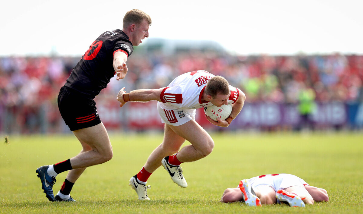 Louth’s Paul Mathews tries to stop Matty Taylor of Cork. Picture: INPHO/Ryan Byrne Louth’s Paul Mathews tries to stop Matty Taylor of Cork. Picture: INPHO/Ryan Byrne