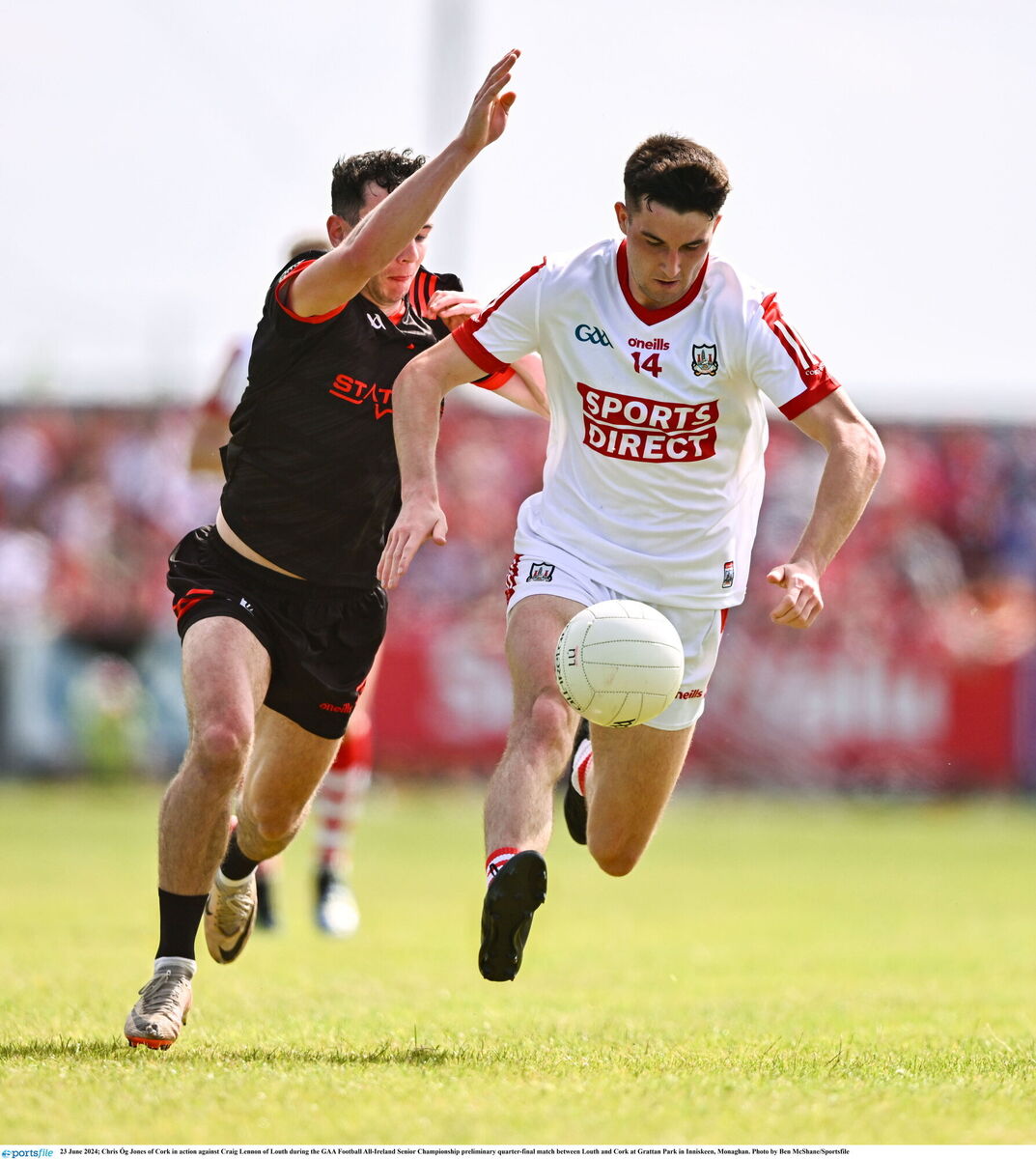 Chris Óg Jones of Cork in action against Craig Lennon of Louth. Picture: Ben McShane/Sportsfile Chris Óg Jones of Cork in action against Craig Lennon of Louth. Picture: Ben McShane/Sportsfile