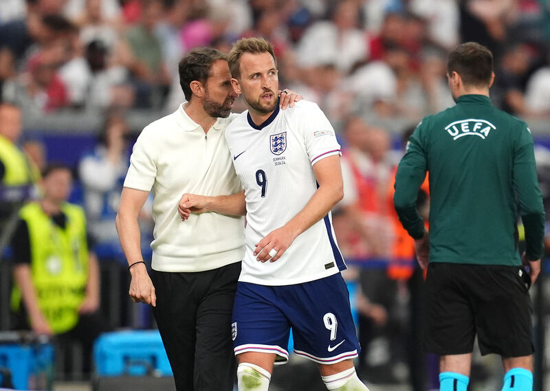 England manager Gareth Southgate puts his arm round Harry Kane as he is substituted during the UEFA Euro 2024 match at the Frankfurt Arena.
