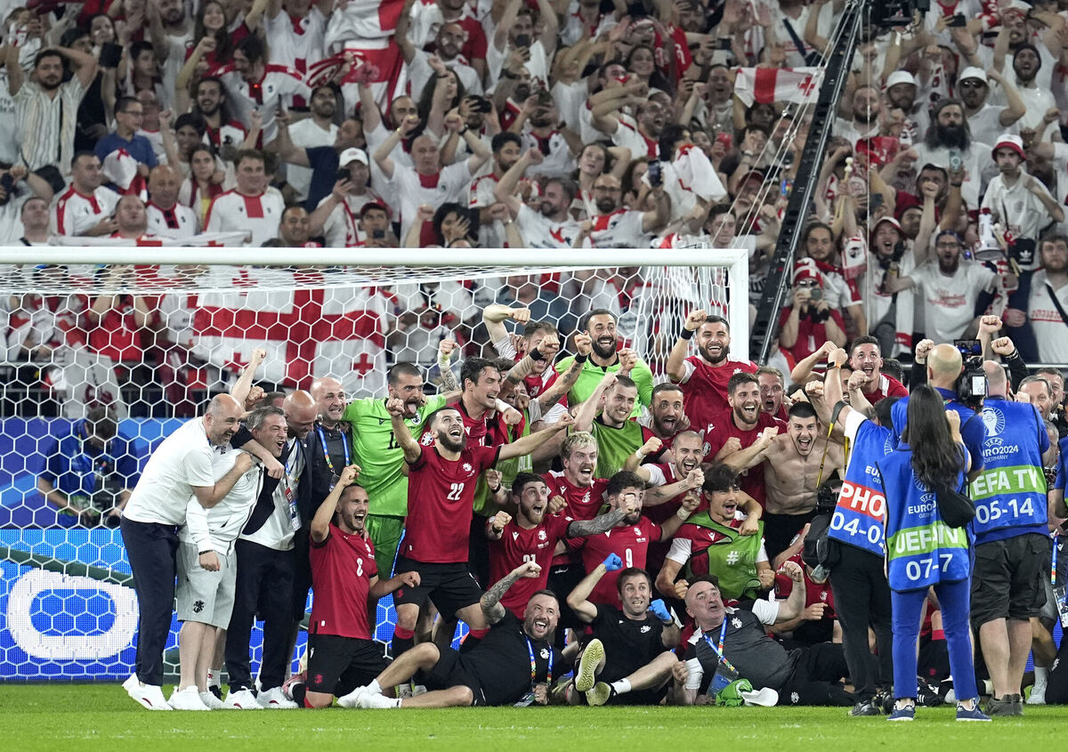Georgia players celebrate reaching the round of 16 following the UEFA Euro 2024 Group F match at the Arena AufSchalke in Gelsenkirchen, Germany. Picture: Nick Potts/PA Wire Georgia players celebrate reaching the round of 16 following the UEFA Euro 2024 Group F match at the Arena AufSchalke in Gelsenkirchen, Germany. Picture: Nick Potts/PA Wire