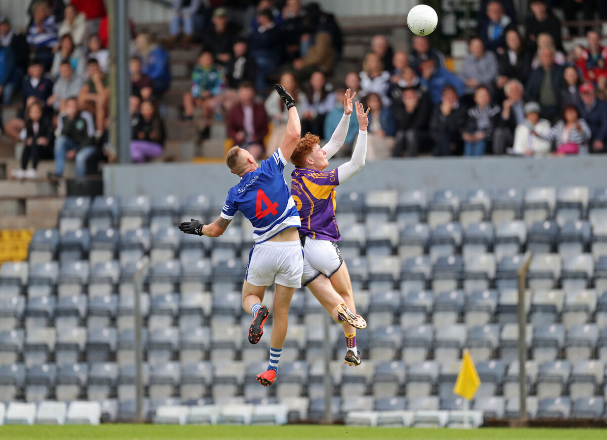 Ballyphehane's Jamie O'Brien jumps for the ball with Pádraig Healy of St Oliver Plunkett's last season. Picture: Jim Coughlan