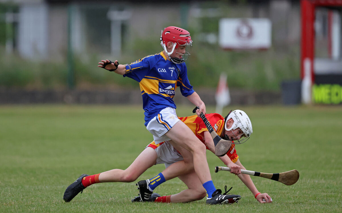 Jack Casey, Éire Óg, under pressure from Finn Barrett, Carrigtwohill. Picture: Jim Coughlan.  Jack Casey, Éire Óg, under pressure from Finn Barrett, Carrigtwohill. Picture: Jim Coughlan.