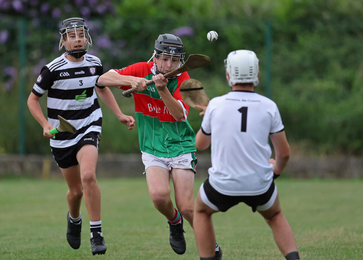 Donagh Conway, Ballinora, gets past Liam Cronin, Midleton and chips goalkeeper Will Stokes, Midleton. Picture: Jim Coughlan.  Donagh Conway, Ballinora, gets past Liam Cronin, Midleton and chips goalkeeper Will Stokes, Midleton. Picture: Jim Coughlan.