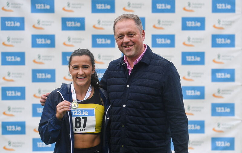 Phil Healy of Bandon AC, Cork, is presented with her gold medal by Minister of State for Sport, Physical Education, and the Gaeltacht, Thomas Byrne TD. Picture: Tyler Miller/Sportsfile