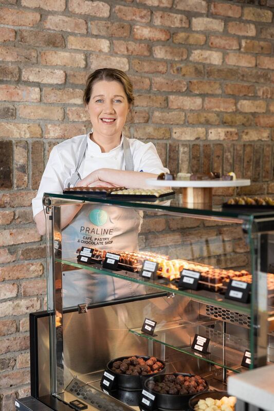 At the counter in her shop.
