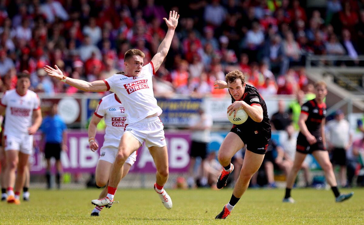 Louth’s Bevan Duffy in action against Tommy Walsh of Cork. Picture: INPHO/Ryan Byrne