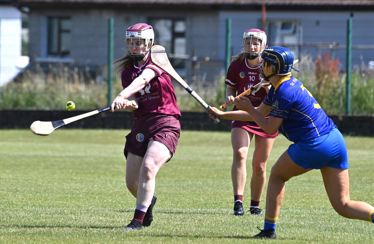 Orla Ní Dhomhnaill, Bishopstown getting her shot away watched by Sofia Daly, St. Finbarrs during the Seandún GAA and Cork City Council Muirgheal MacSwiney junior Camogie cup final at Ballinlough. Picture Dan Linehan Orla Ní Dhomhnaill, Bishopstown getting her shot away watched by Sofia Daly, St. Finbarrs during the Seandún GAA and Cork City Council Muirgheal MacSwiney junior Camogie cup final at Ballinlough. Picture Dan Linehan