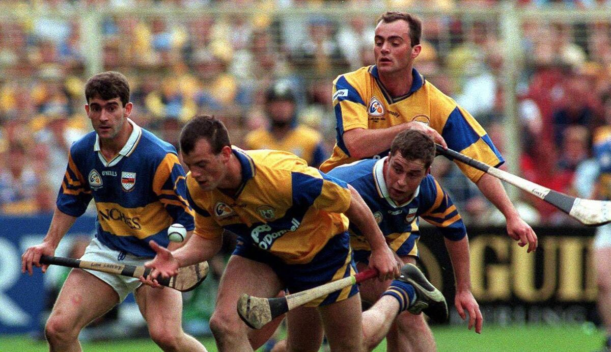 Ollie Baker of Clare claims possession in the 1997 All-Ireland SHC final as Tipperary's Liam Sheedy looks on. Picture: Ray McManus/Sportsfile