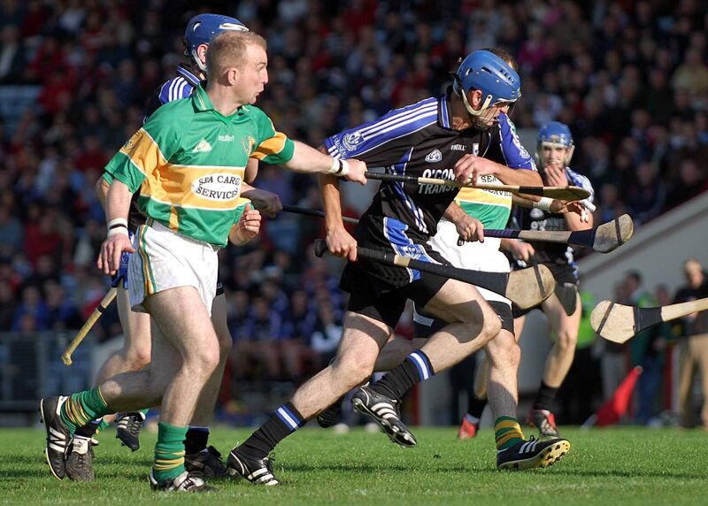 Sarsfields' Ronan Murphy keeps a tight hold on the sliothar as he comes under pressure from Newtownshandrum's Diarmuid Gleeson during their Cork Senior Hurling Championship quarter-final at Pairc Ui Chaoimh. 