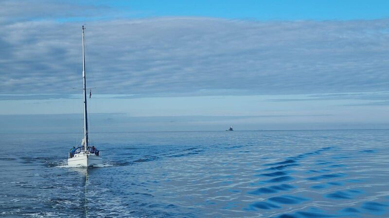 The yacht under tow with the Fastnet Rock in the background. Picture: Castletownbere RNLI Facebook page