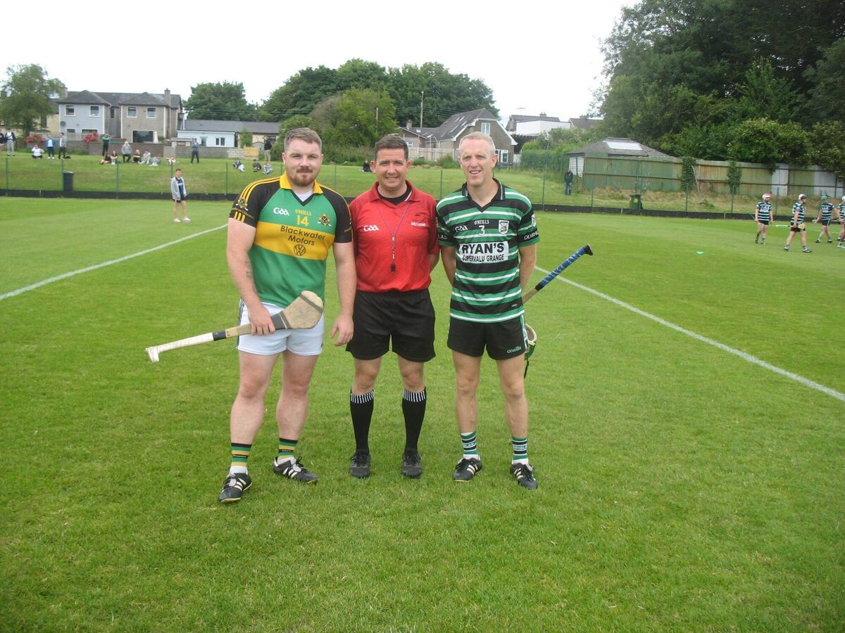 Captains & Referee (L-R) Eric Healy (Glen Rovers), Referee Colm Lyons, and Pat Tobin (Douglas) Captains & Referee (L-R) Eric Healy (Glen Rovers), Referee Colm Lyons, and Pat Tobin (Douglas)