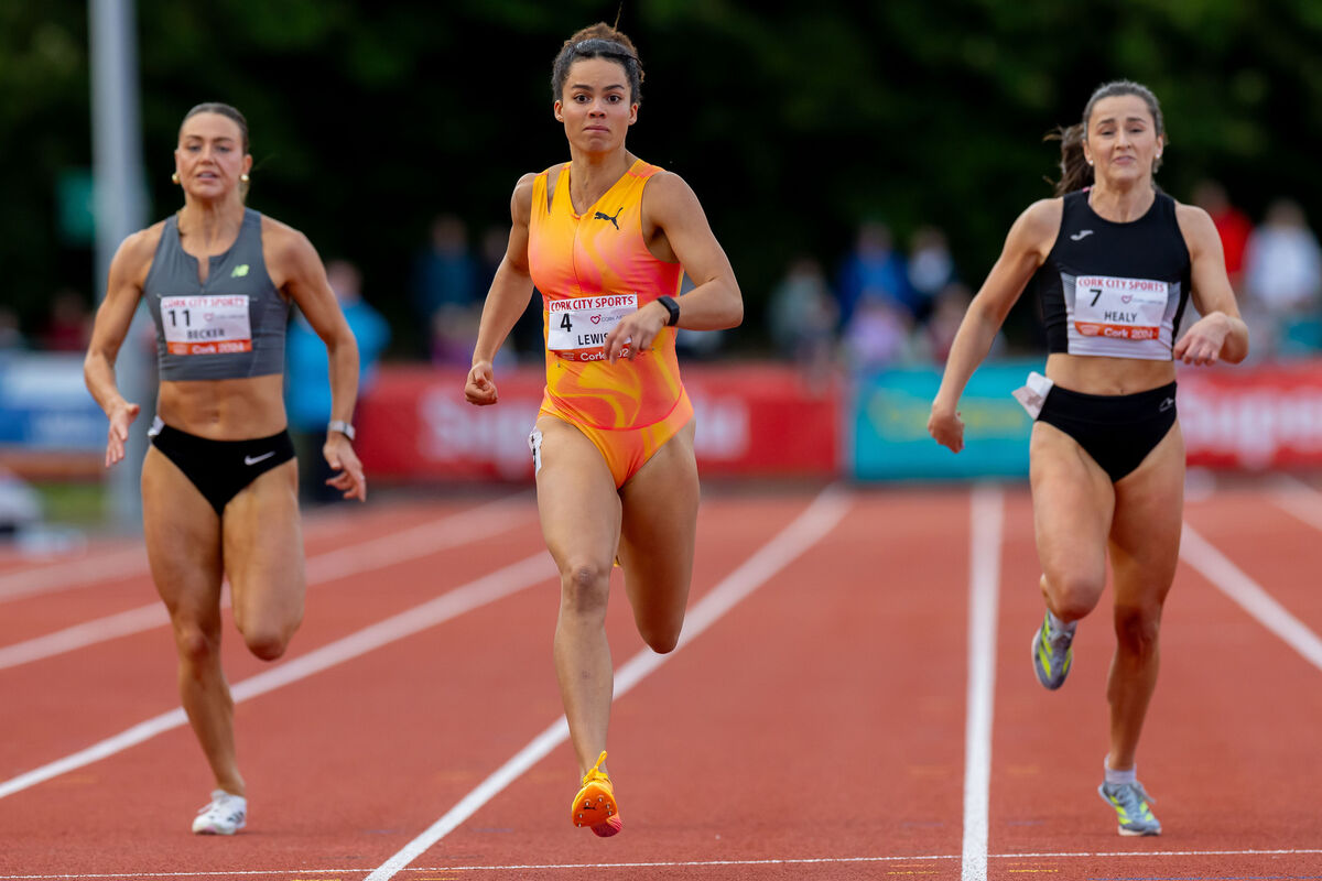 Women’s 200m: Ireland’s Sophie Becker and Phil Healy running alongside eventual winner Torrie Lewis of Australia. Picture: INPHO/Morgan Treacy