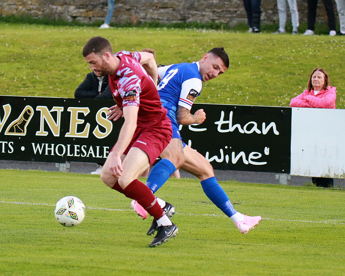 Brendan Frahill, Cobh Ramblers, in control of the ball against Enda Curran, Treaty United. Picture: Brendan Gleeson