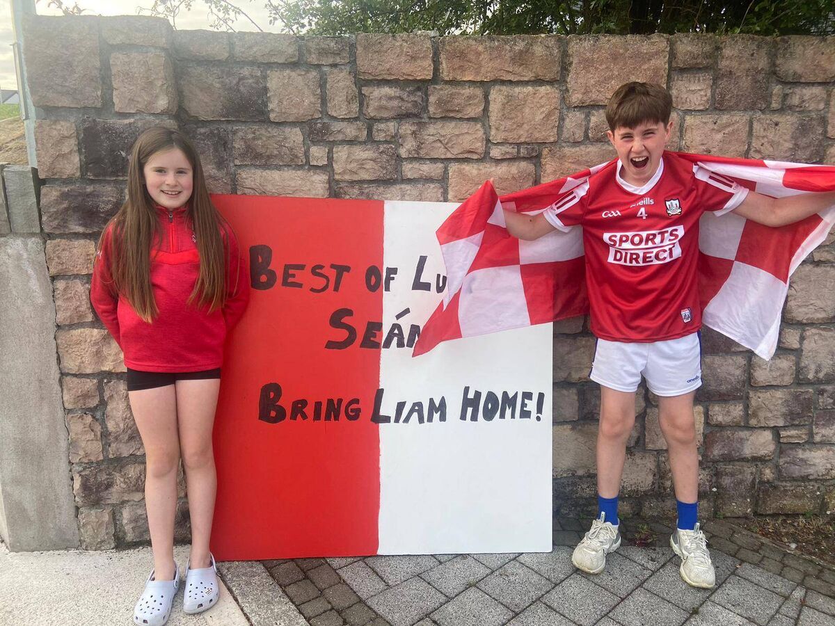 Oisin and Lauren Barry, Inniscarra GAA, donning red and white ahead of All-Ireland final. Photo: Inniscarra GAA Club.