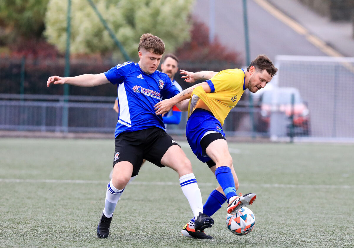 Carrigaline's Richard Duggan and Wilton's Cian McCarthy tussle over the ball. Picture: David Creedon Carrigaline's Richard Duggan and Wilton's Cian McCarthy tussle over the ball. Picture: David Creedon