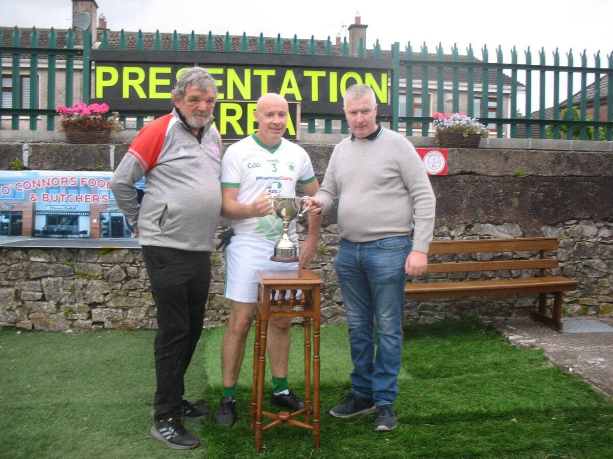 Michael Buckley (Seandún chairman) and Cormac O'Connor (O'Connor Butchers and Foodhall) presenting the trophy to Passage captain Gareth Cleary at Ballinlough. Michael Buckley (Seandún chairman) and Cormac O'Connor (O'Connor Butchers and Foodhall) presenting the trophy to Passage captain Gareth Cleary at Ballinlough.