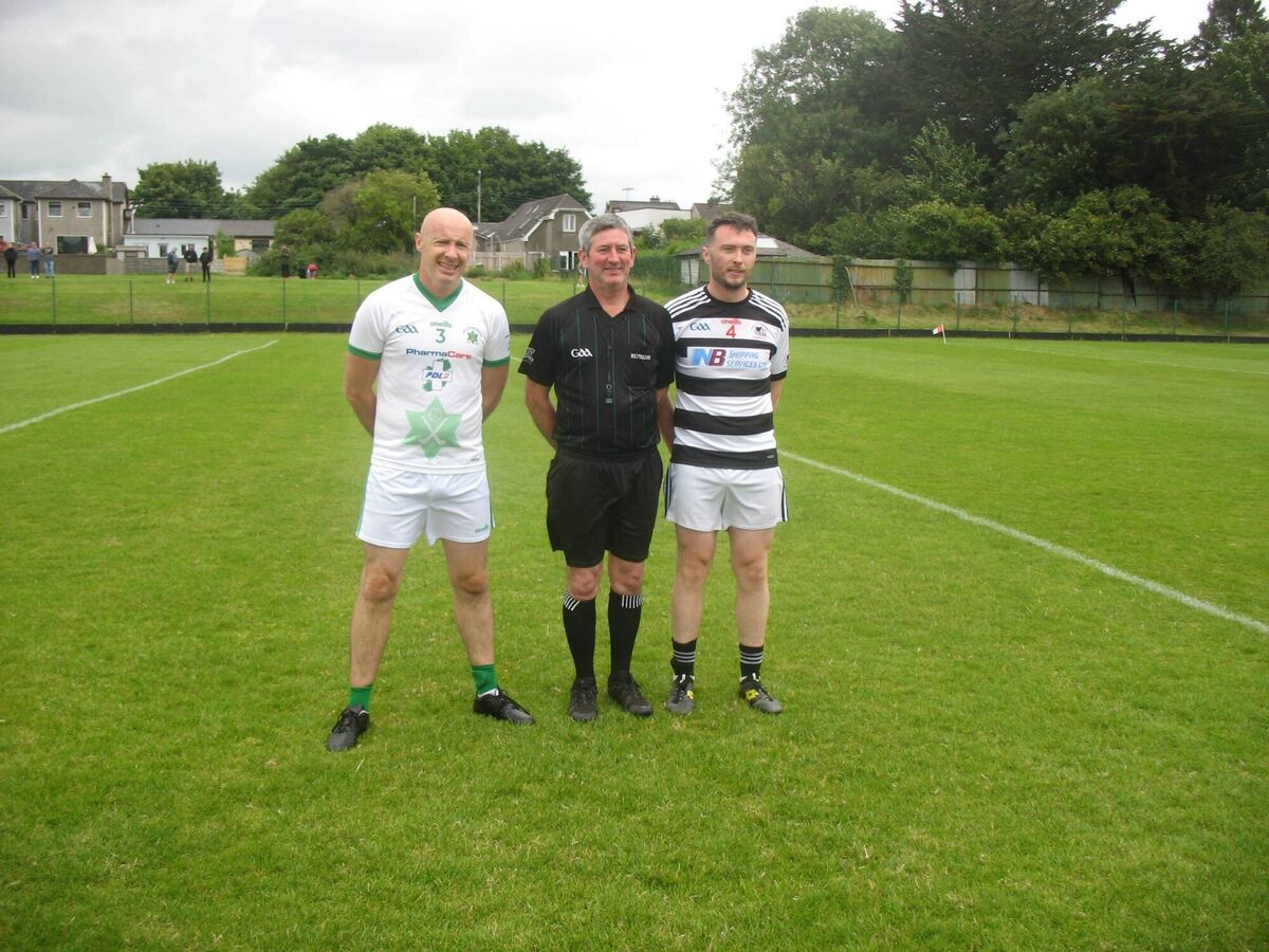 Gareth Cleary (Passage captain), referee Mark Maher and Alan Hosford (St Nicholas captain) at Ballinlough recently. Gareth Cleary (Passage captain), referee Mark Maher and Alan Hosford (St Nicholas captain) at Ballinlough recently.