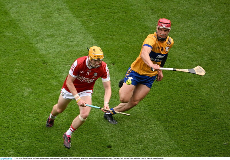 Cork's Shane Barrett tries to get away from Clare's Jon Conlon. Picture: Daire Brennan/Sportsfile