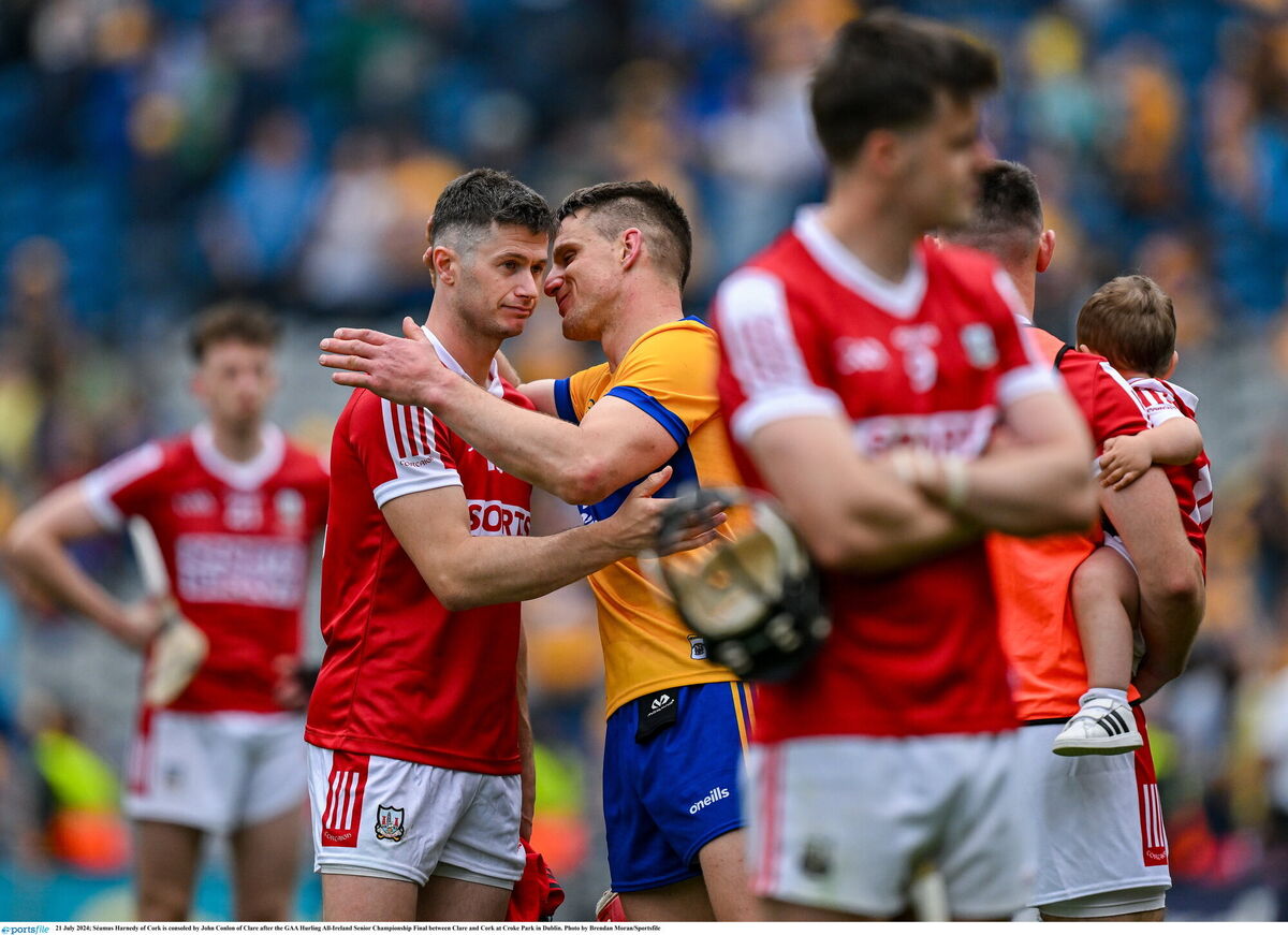 Séamus Harnedy of Cork is consoled by Clare's John Conlon. Picture: Brendan Moran/Sportsfile
