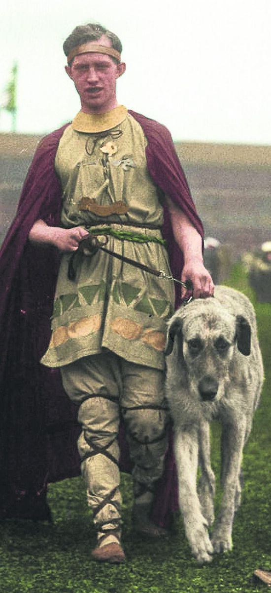 LET THE GAMES COMMENCE: A ‘warrior’ in reimagined Celtic dress, wearing a colourful cloak and leading the requisite Irish wolfhound, at the opening ceremony of the 1924 Tailteann Games Picture from ‘A Nation Is Born: Ireland In Colour 1923-38’, published by Gill Books, from an original photo from the National Library of Ireland