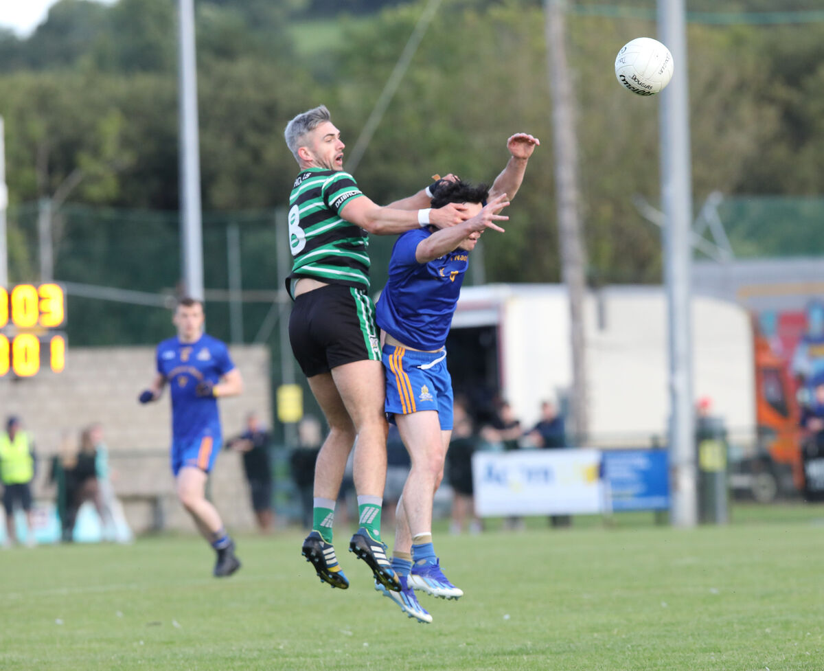  Conor Kingston of Douglas and St Finbarr's Colm Scully contest possession in the air during the McCarthy Insurance Group Cork Premier SFC game at Carrigaline. Picture: David Creedon