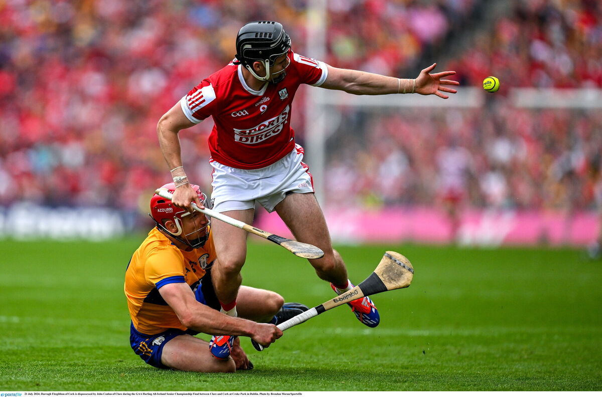Darragh Fitzgibbon of Cork is tripped by John Conlon of Clare. Picture: Brendan Moran/Sportsfile