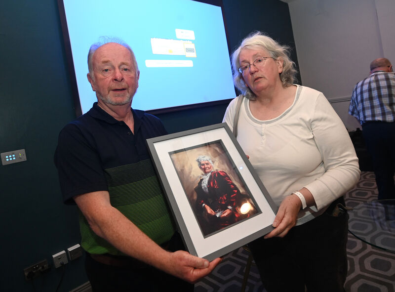 Ger O’Mahony presents a framed print of Mother Jones to speaker Julianna Minihan at the Spirit of Mother Jones Festival 2024 at The Maldron Hotel, Shandon. Picture: Larry Cummins
                    