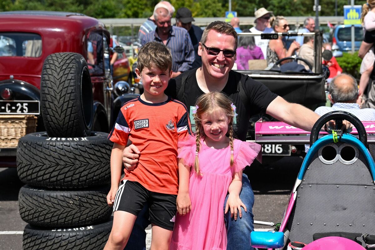 Laurence Dusoswa founder of the sim racing community, Potato Nation who sponsor F1000 racer Kayleigh Cole, pictured with his children Ronan, 7, and Sophie, 5, beside Kayleigh’s race car at the Ballincollig Vintage Motor Show. Picture Chani Anderson Laurence Dusoswa founder of the sim racing community, Potato Nation who sponsor F1000 racer Kayleigh Cole, pictured with his children Ronan, 7, and Sophie, 5, beside Kayleigh’s race car at the Ballincollig Vintage Motor Show. Picture Chani Anderson